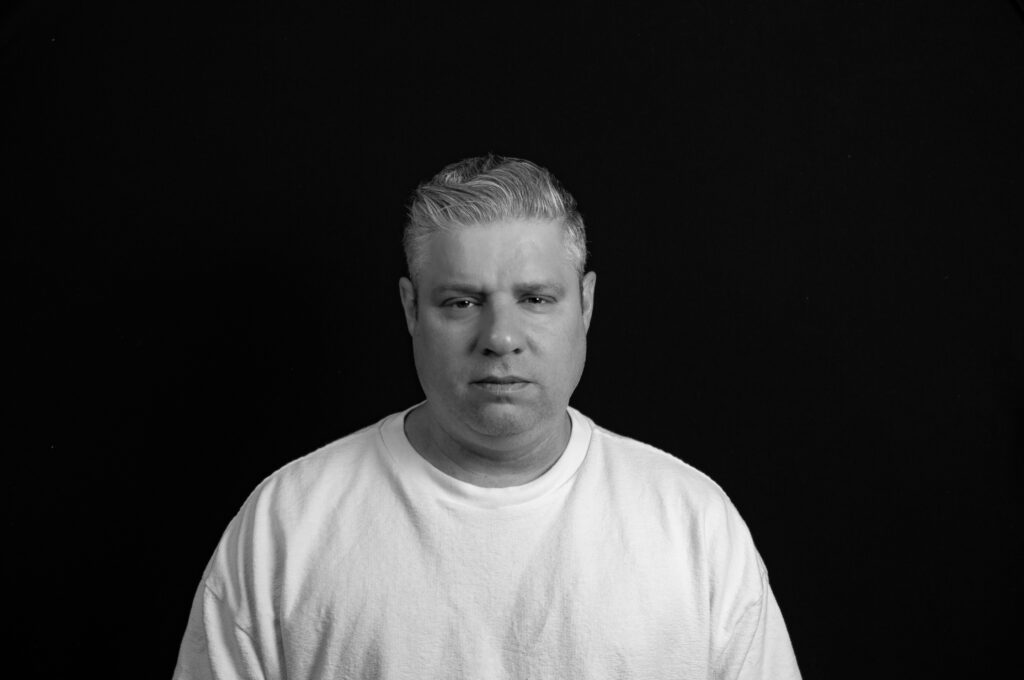 Headshot against black background